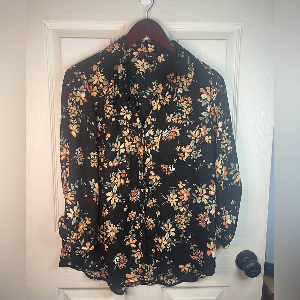 B Wear long sleeve‎ orange floral button down blouse.